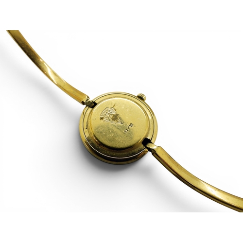 731 - A ladies Gucci 11/12 watch with interchangeable multi coloured bezels.
