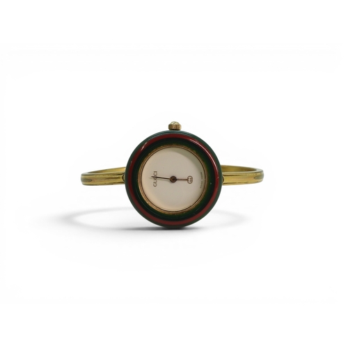 731 - A ladies Gucci 11/12 watch with interchangeable multi coloured bezels.