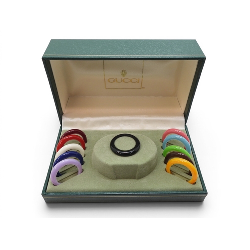 731 - A ladies Gucci 11/12 watch with interchangeable multi coloured bezels.