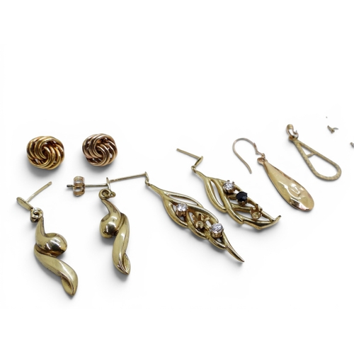 732 - A 9ct gold Nan pendant together with a collection of gold and yellow metal earrings, a mourning broo... 