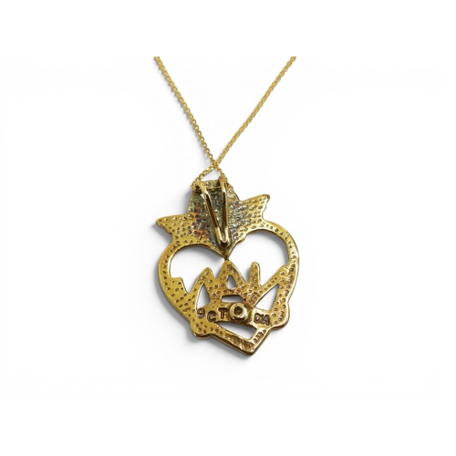 732 - A 9ct gold Nan pendant together with a collection of gold and yellow metal earrings, a mourning broo... 