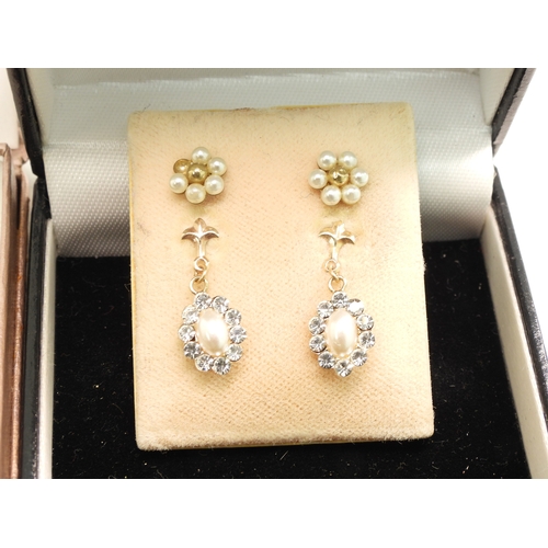 732 - A 9ct gold Nan pendant together with a collection of gold and yellow metal earrings, a mourning broo... 