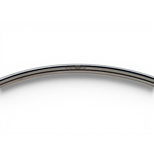 734 - A 9ct white gold bangle set with blue topaz, weight 4.1gms