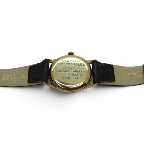 736 - A 9ct gold gents Timor watch, inscribed verso, with black leather strap.