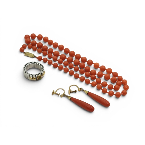 737 - A string of coral beads with a 9ct gold clasp, length 56cm, together with a pair of coral drop earri... 