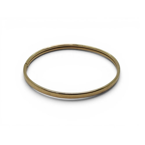 738 - A 9ct gold bangle, weight 5.4gms