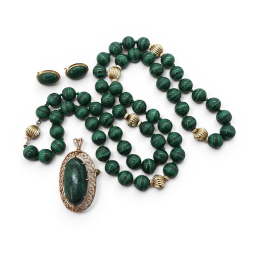743 - A String of malachite beads, with a 14k gold clasp and accent beads, together with a 14k gold brooch... 