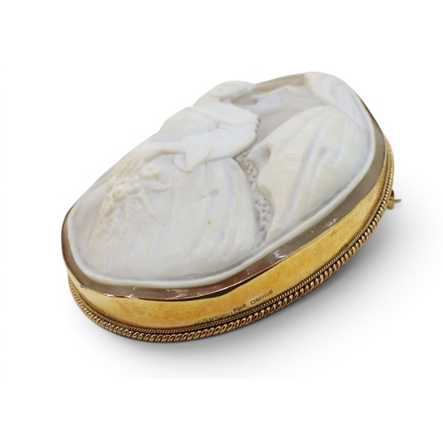744 - A large 9ct gold mounted cameo brooch, dimensions 8cm x 6cm, weight 31.1gms