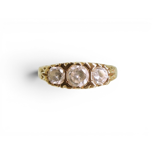 756 - A three clear gem set ring on a decorative scroll mount, size O, weight 3.4gms.
