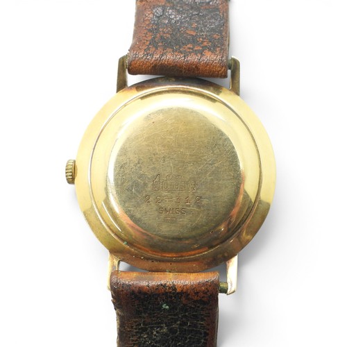 725 - A 14ct gold gents Elco Automatic watch with a brown leather strap, weight including strap and mechan... 