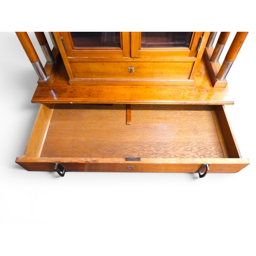 2010A - AN IMPRESSIVE EARLY 20TH CENTURY CONTINENTAL BLONDE OAK ARTS & CRAFTS DISPLAY CABINETsurmounted ... 