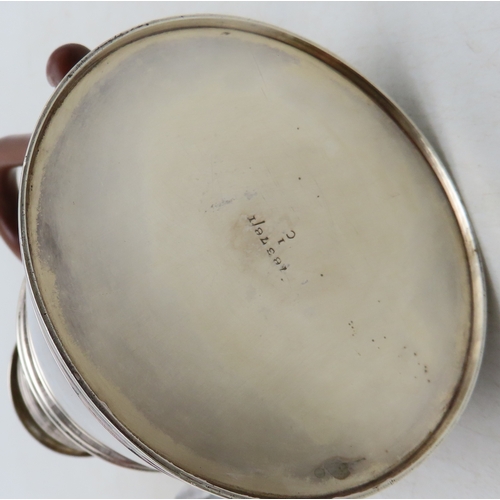 900 - A George V silver coffee pot, Adie Brothers Ltd, Birmingham 1926, in the George II style, with a car... 