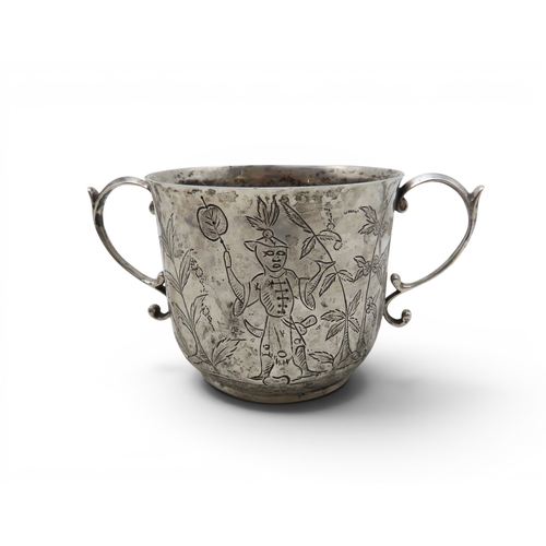 910 - A silver porringer, by William Comyns, London 1934, decorated with Chinoserie scenes, 170gms