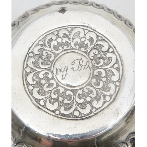 2403 - A PAIR OF BURMESE SILVER BOWLSwith all-over repousse decoration of deities, figures and animals, wit... 
