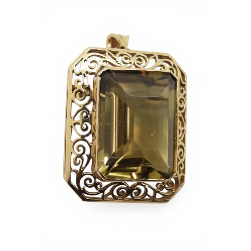705 - A quartz pendant brooch, with pretty scroll mount, the bail is stamped 750 18k. Set with a 20mm x 15... 