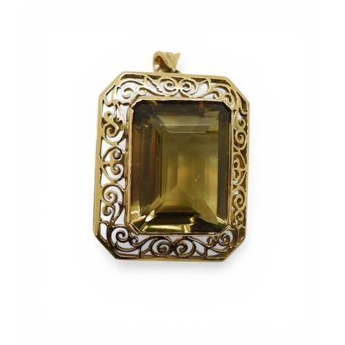 705 - A quartz pendant brooch, with pretty scroll mount, the bail is stamped 750 18k. Set with a 20mm x 15... 