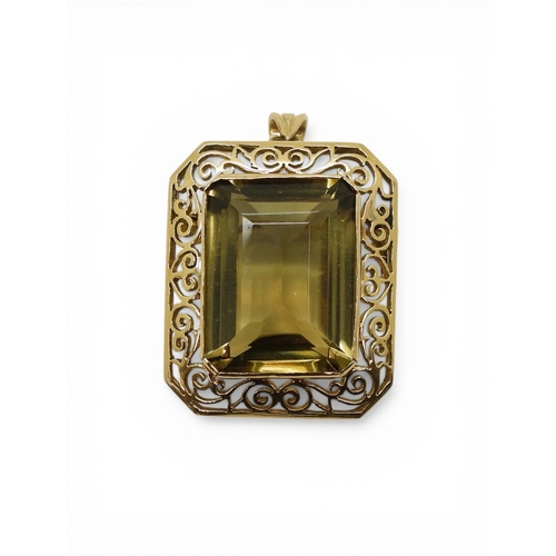 705 - A quartz pendant brooch, with pretty scroll mount, the bail is stamped 750 18k. Set with a 20mm x 15... 