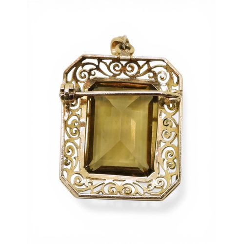 705 - A quartz pendant brooch, with pretty scroll mount, the bail is stamped 750 18k. Set with a 20mm x 15... 