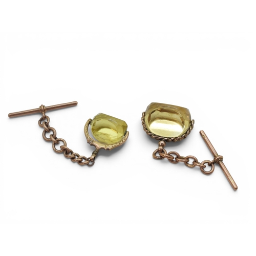 706 - A 9ct gold citrine fob seal with a short length a 9ct gold chain with a 'T' bar, together with a gla... 