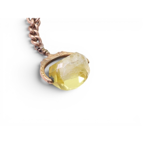 706 - A 9ct gold citrine fob seal with a short length a 9ct gold chain with a 'T' bar, together with a gla... 