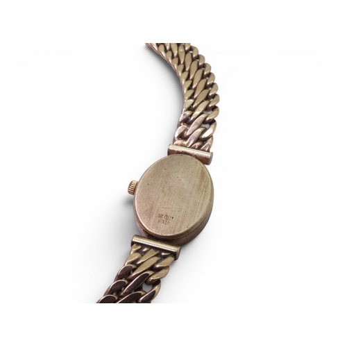 709 - A 9ct gold ladies Vicence quartz watch with integral strap, full UK hallmarks, length of strap 21.5c... 