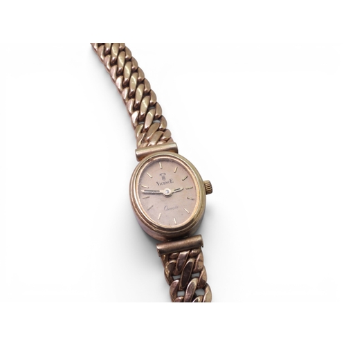 709 - A 9ct gold ladies Vicence quartz watch with integral strap, full UK hallmarks, length of strap 21.5c... 