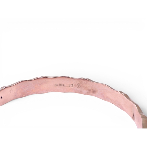 711 - A 9ct rose gold bamboo pattern bangle, with Birmingham hallmarks for 1921, weight 8gms