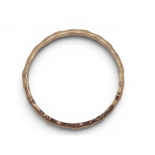 711 - A 9ct rose gold bamboo pattern bangle, with Birmingham hallmarks for 1921, weight 8gms