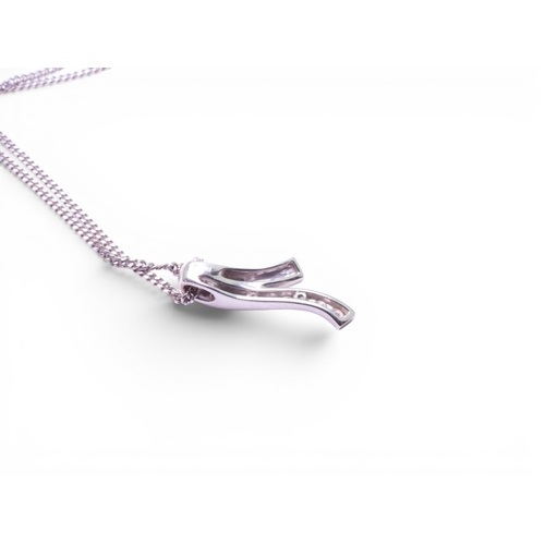 713 - An 18ct gold diamond set pendant weight 1.9gms, with a 9ct gold chain, together with similar earring... 