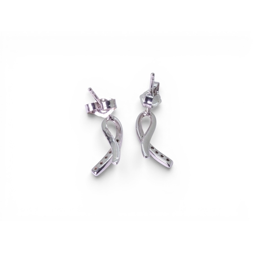 713 - An 18ct gold diamond set pendant weight 1.9gms, with a 9ct gold chain, together with similar earring... 