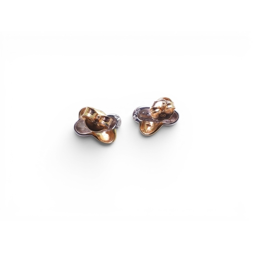 714 - A pair of 18ct yellow and white gold kiss shaped earrings, weight 3gms