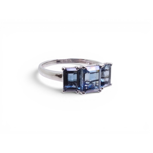 715 - A 9ct white gold 'The Jewellery Channel' ring, set with three Swiss blue topaz. Size T, weight 3.5gm... 