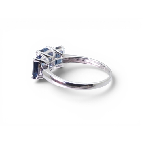 715 - A 9ct white gold 'The Jewellery Channel' ring, set with three Swiss blue topaz. Size T, weight 3.5gm... 