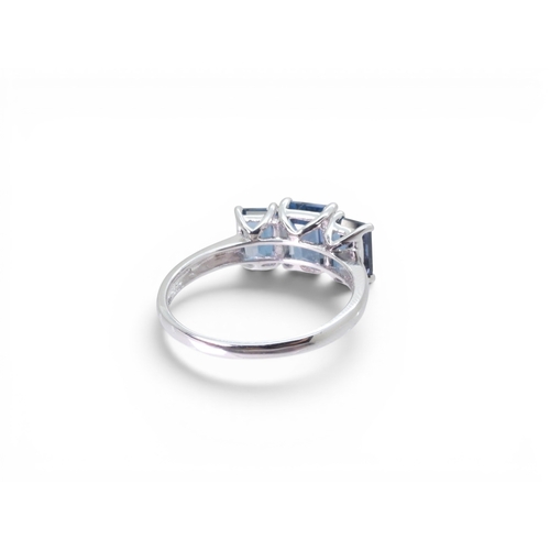 715 - A 9ct white gold 'The Jewellery Channel' ring, set with three Swiss blue topaz. Size T, weight 3.5gm... 