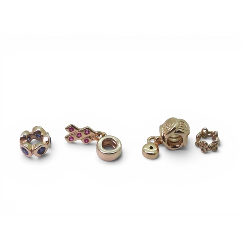 718 - Four 14k gold Pandora charms, three set with gemstones, all fully hallmarked and stamped with the ma... 