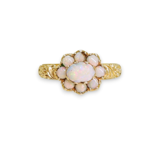 724 - A 9ct gold opal cluster ring, with a decorative scroll mount (two opals af) size P1/2, weight 3.2gms