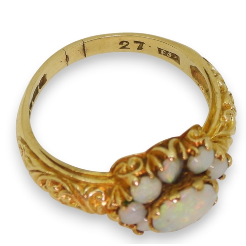 724 - A 9ct gold opal cluster ring, with a decorative scroll mount (two opals af) size P1/2, weight 3.2gms
