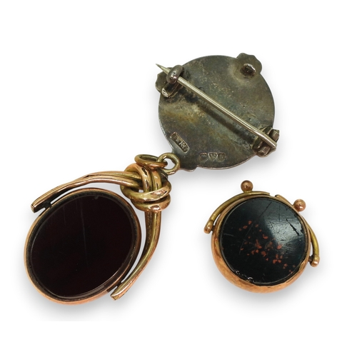 726 - A 15ct and diamond topped lapel pin, a 10K fob seal a partial fob seal, a yellow metal brooch, weigh... 