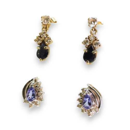 734 - A pair of 14k gold tanzanite and diamond cluster earrings, weight 2gms, and a pair of yellow metal s... 