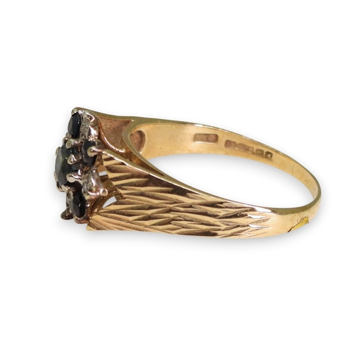739 - A 9ct gold retro sapphire and diamond accent flower ring, size R1/2, weight 3.4gms