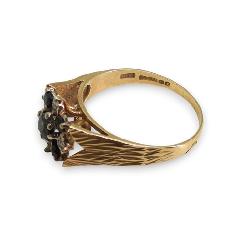 739 - A 9ct gold retro sapphire and diamond accent flower ring, size R1/2, weight 3.4gms