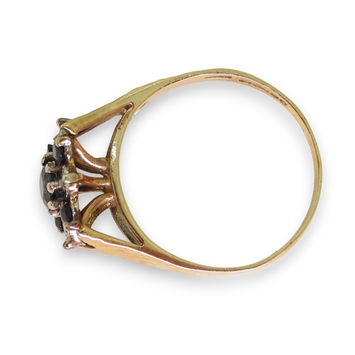 739 - A 9ct gold retro sapphire and diamond accent flower ring, size R1/2, weight 3.4gms