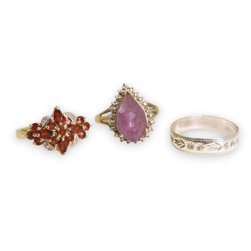 740 - A 9ct white gold wedding ring, size S1/2, a 9ct gold garnet and diamond accent cluster ring, size P1... 