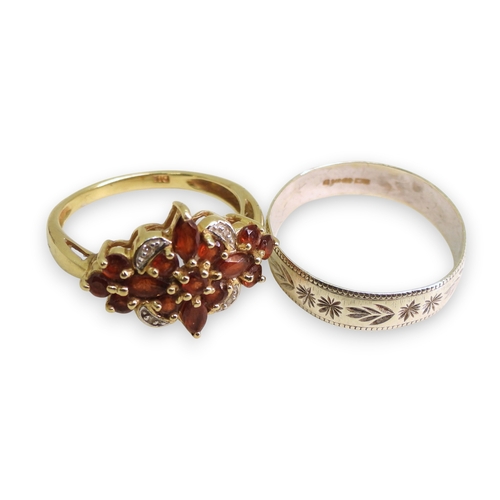 740 - A 9ct white gold wedding ring, size S1/2, a 9ct gold garnet and diamond accent cluster ring, size P1... 