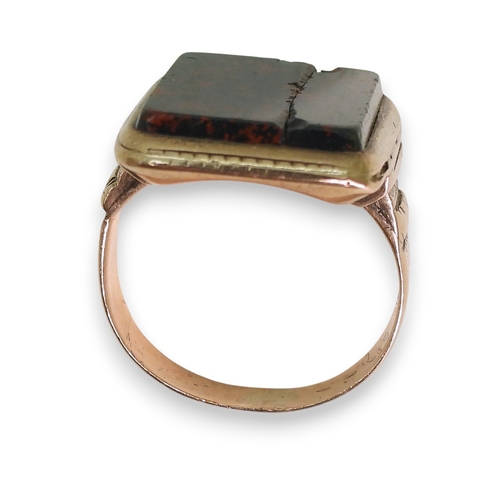 741 - A yellow metal bloodstone signet ring, size K, (af) weight 6.8gms