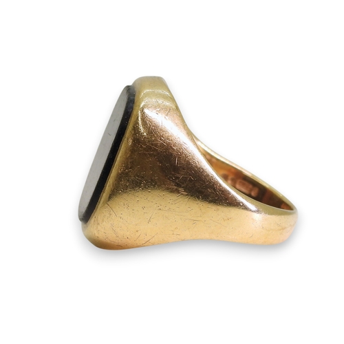 742 - A 9ct gold onyx signet ring, size R1/2, weight 8.2gms