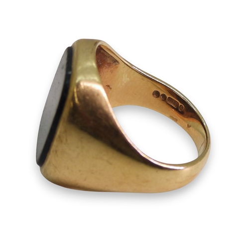 742 - A 9ct gold onyx signet ring, size R1/2, weight 8.2gms