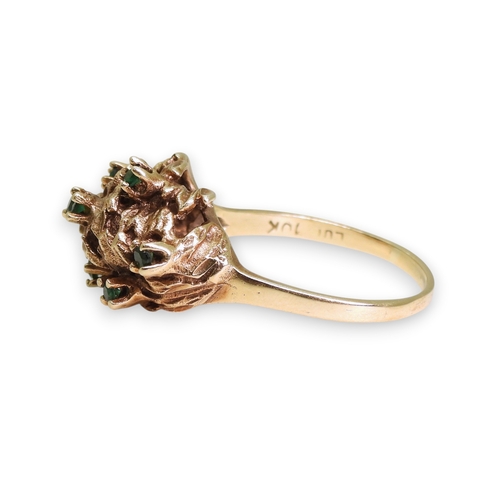 747 - A 10k gold green gem set retro ring, size R1/2, weight 5.2gms