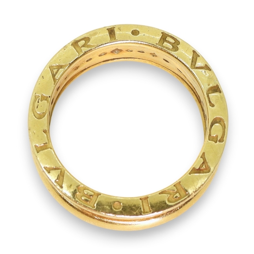 749 - A yellow metal Bvlgari style ring, set with diamonds, finger size S1/2, weight 13.5gms