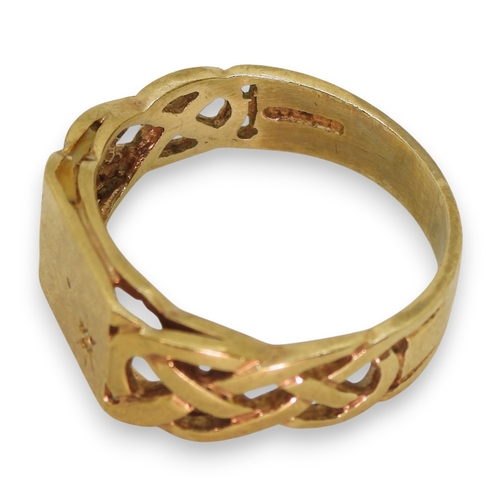 751 - A 9ct gold signet rings set with a diamond accent with celtic knotwork shoulders, size U1/2, weight ... 
